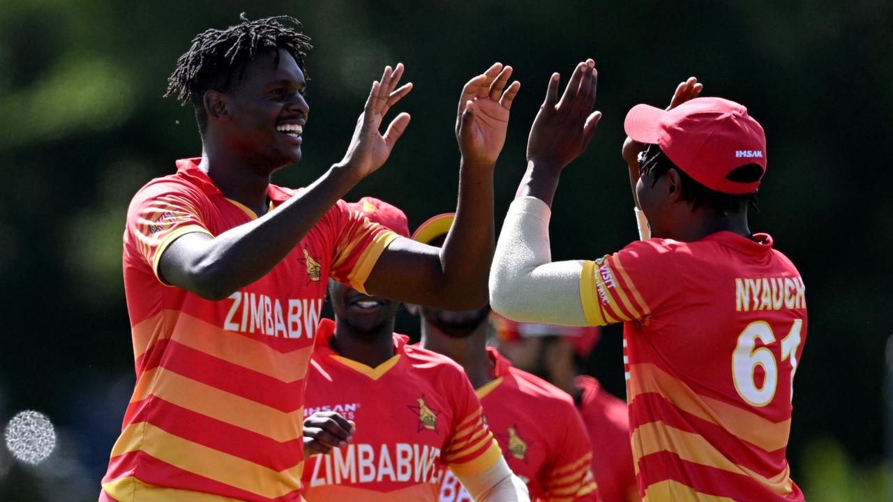 Zimbabwe's Richard Ngarava (left) celebrates with Victor Nyauchi after dismissing Australia's captain Aaron Finch. Picture: AFP