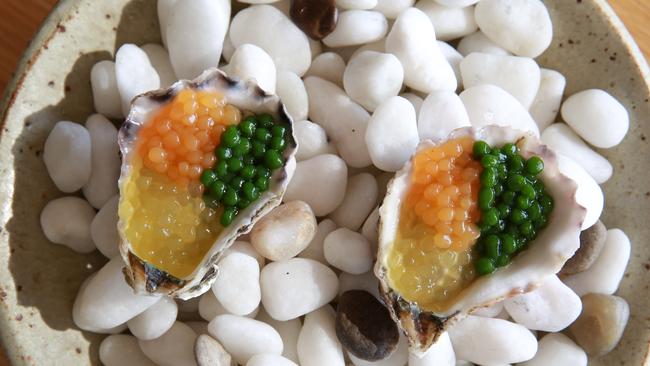 Oysters with honey dew rock melon and dill pearls.