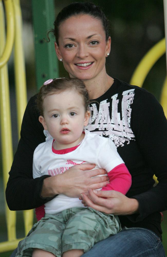 Queensland Firebirds' Katie Walker with her daughter Kobi.