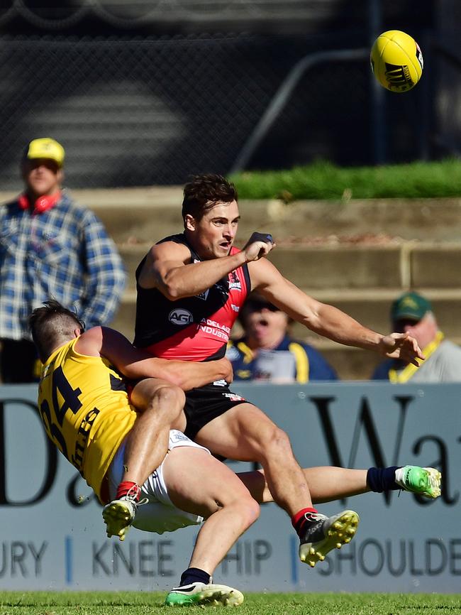 Eagle Sam Rowland wraps up West's Aaron Anderson. Picture: Tom Huntley