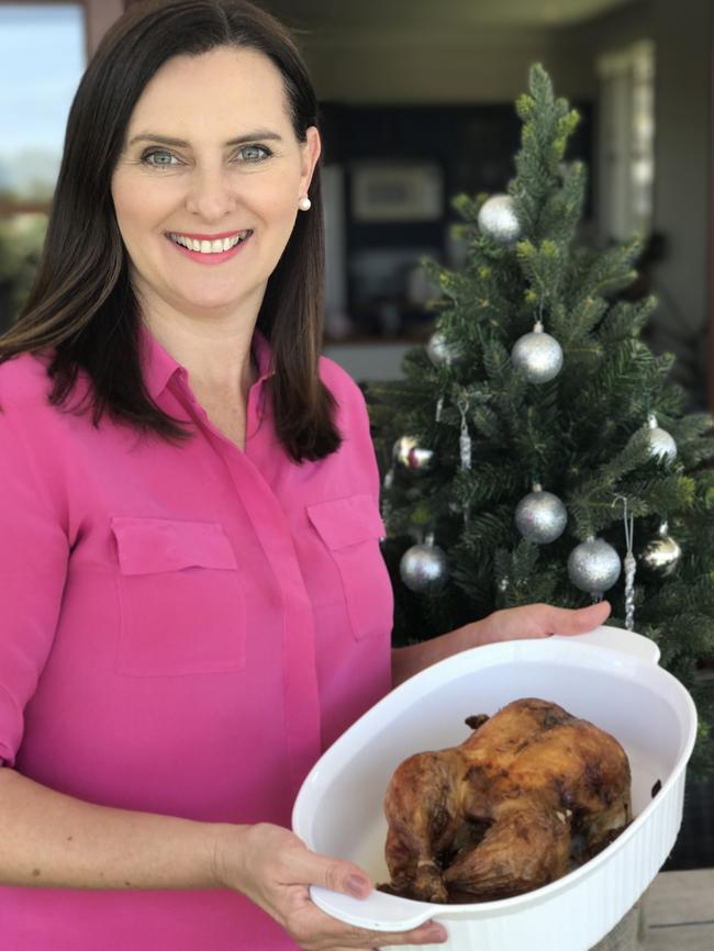 Queensland Urban Utilities spokeswoman Michelle Cull with a Christmas roast.