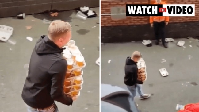 Astonishing moment football fan carries 48 beers in one go