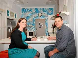 SMILES ALL ROUND: South Australian couple Jessica Yates and Jarrod Bennett sit in the kitchen of their new home in Toogoom. Picture: Seven Network