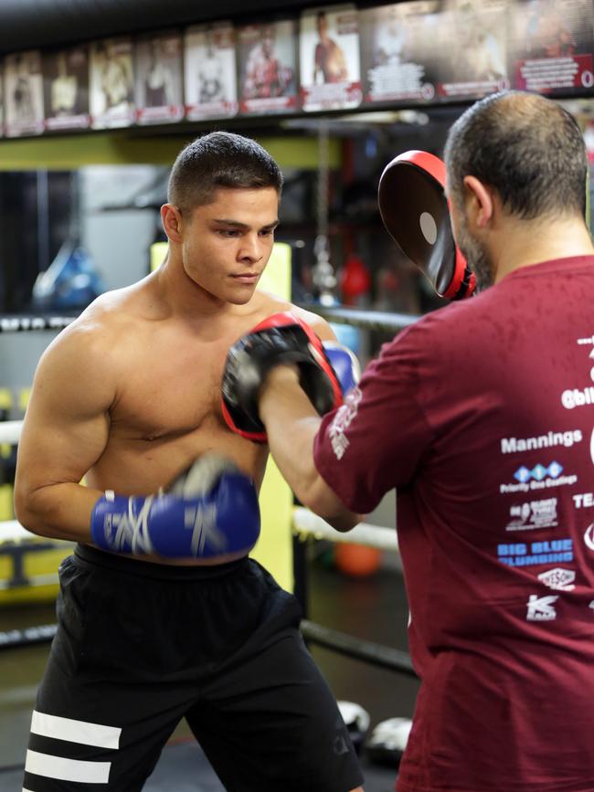 Bilal Akkawy training with his dad Mick Akkawy on his training ground Hardcore Gym. Picture: Christian Gilles