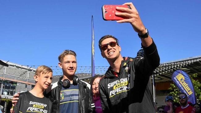 FAN FOCUS: Supercars driver Chaz Mostert takes a selfie with Ethan, Decklyn and Madonna Malivoire at the fan day at Orion Shopping Centre. Picture: Rob Williams