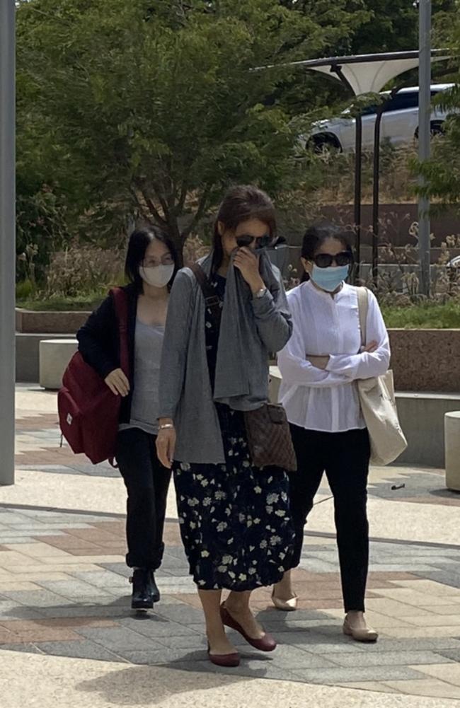 Jennifer Mui Len Chen (white shirt) is charged with stabbing her daughter's boyfriend, pictured at Armadale Magistrates Court. Picture: Angie Raphael/ NCA NewsWire