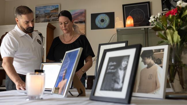 Michael and Kerri-Lyn Stewart in their dining room where they keep photographs and other mementos of their 16-year-old son, Balin. Picture: David Kelly