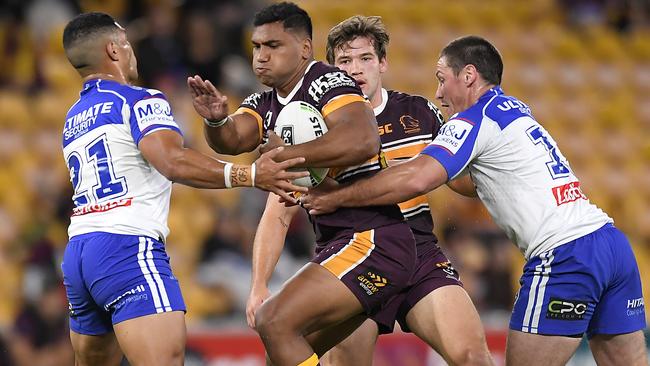 BRISBANE, AUSTRALIA - JULY 11: Tevita Pangai Junior of the Broncos takes on the defence during the round nine NRL match between the Brisbane Broncos and the Canterbury Bulldogs at Suncorp Stadium on July 11, 2020 in Brisbane, Australia. (Photo by Albert Perez/Getty Images)