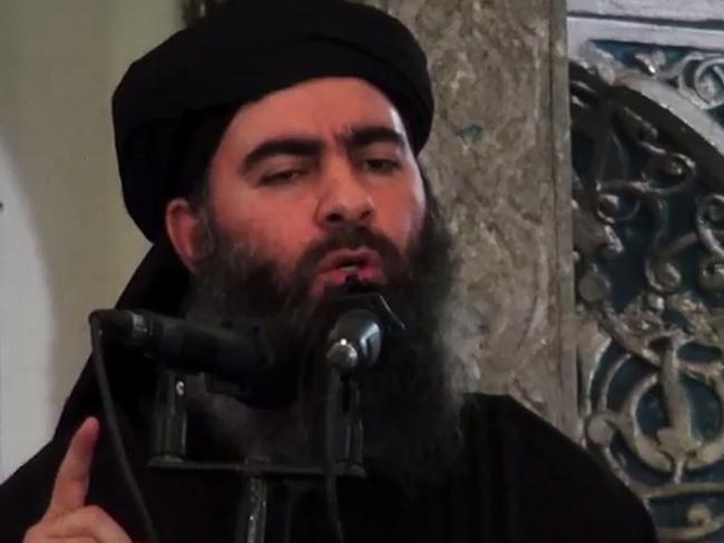 (FILES) In this file photo taken on July 05, 2014 An image grab taken from a propaganda video released on July 5, 2014 by al-Furqan Media allegedly shows the leader of the Islamic State (IS) jihadist group, Abu Bakr al-Baghdadi, aka Caliph Ibrahim, adressing Muslim worshippers at a mosque in the militant-held northern Iraqi city of Mosul. - The elusive chief of the IS group al-Baghdadi has appeared for the first time in five years in a propaganda video released on April 29 by the jihadist organisation. It is unclear when the footage was filmed, but Baghdadi referred in the past tense to the months-long fight for Baghouz, IS's final bastion in eastern Syria, which ended last month. (Photo by - / AL-FURQAN MEDIA / AFP)