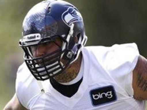 Seattle Seahawks' Jesse Williams runs through a drill during NFL football minicamp Tuesday, June 11, 2013, in Renton, Wash. (AP Photo/Elaine Thompson)