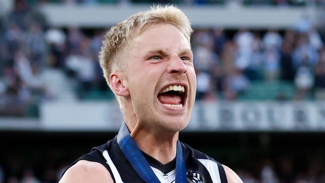 MELBOURNE, AUSTRALIA - SEPTEMBER 30: Billy Frampton of the Magpies celebrates after receiving his premiership medal during the 2023 AFL Grand Final match between the Collingwood Magpies and the Brisbane Lions at the Melbourne Cricket Ground on September 30, 2023 in Melbourne, Australia. (Photo by Dylan Burns/AFL Photos via Getty Images)