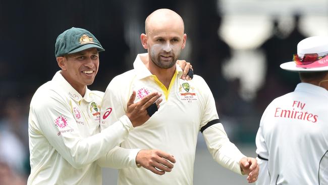 Usman Khawaja (L) gave Lyon some words of advice that paid off big time. Picture: AFP