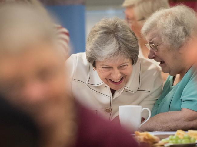 Britain’s Prime Minister Theresa May speaks with locals after launching the loneliness strategy. Picture: Stefan Rousseau