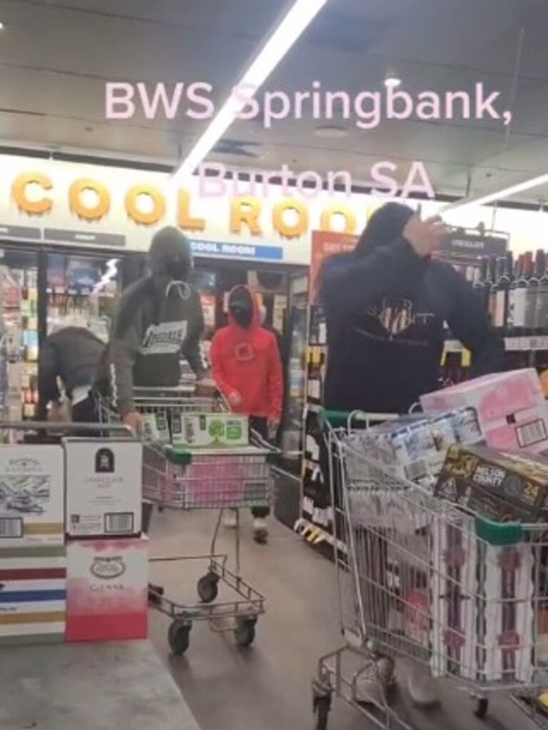 Four young men allegedly steal trolley loads of alcohol from the Burton BWS in Adelaide's north. Picture: TikTok