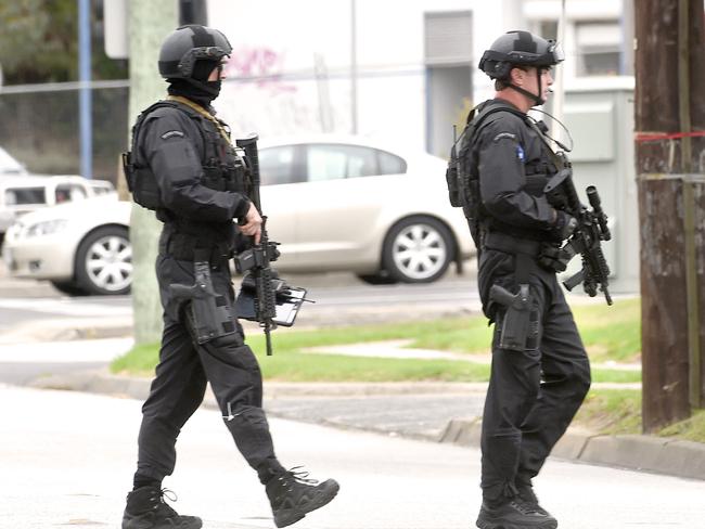 Heavily armed special operations officers were involved in the dramatic arrests. Picture: Mike Keating