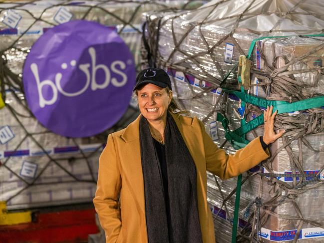 MELBOURNE, AUSTRALIA - JUNE 12: Kristy Carr, chief executive of Bubs Australia poses in front of pallets of Bubs baby formula at Melbourne Airport on June 12, 2022 in Melbourne, Australia. Bubs Australia will export approximately 4.6 millions bottle of instant baby formula to the United States where they are experiencing a shortage, under an agreement between Australia and the Biden Administration. (Photo by Asanka Ratnayake/Getty Images)