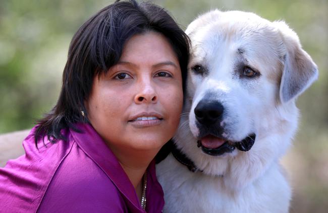 Animal rescue volunteer Adriana Gonzalez with her Anatolian Shepherd puppy in Baulkham Hills. Picture: AAP Image/Angelo Velardo