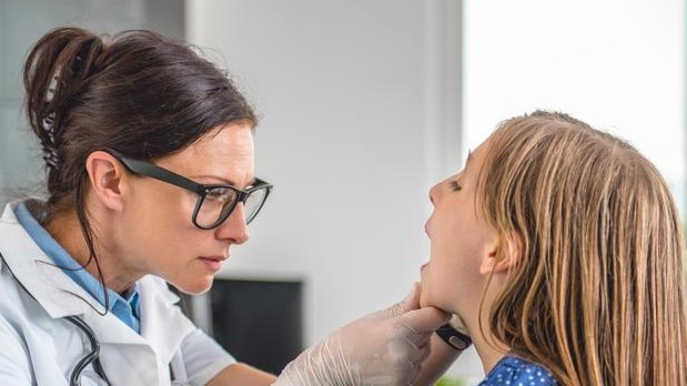 A doctor inspects a child’s throat in this stock image photo. Picture: Supplied