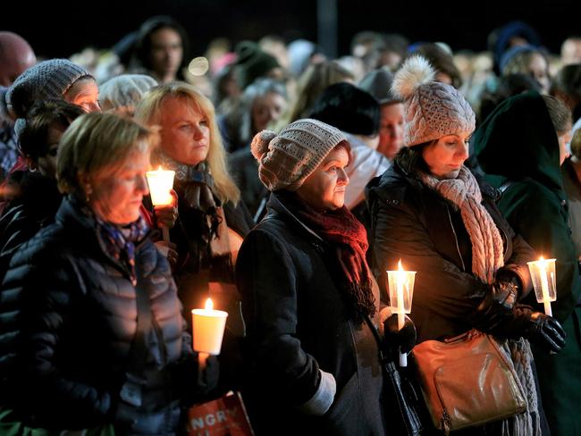 Mourners stand in silence at a vigil for Eurydice Dixon. Picture: Mark Stewart