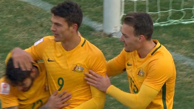 The Olyroos celebrate a goal.