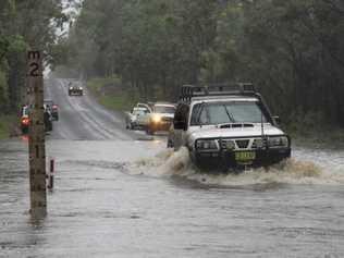 Flash flooding begins on the Orara Way between Lanitza Service Station and Curlew Drive. Picture: TIM JARRETT