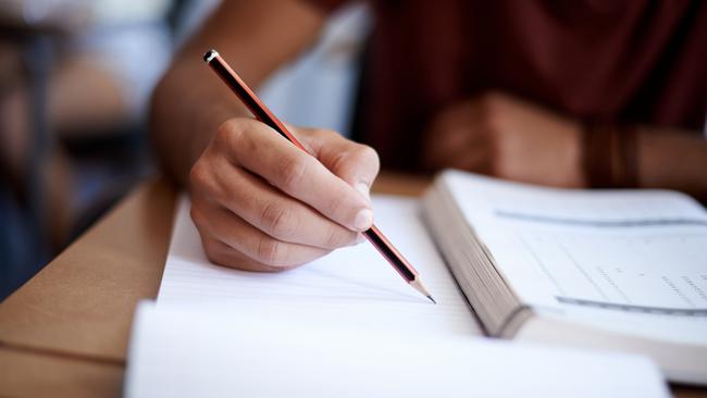 Close up of hands of a student during an exam. Picture: istock