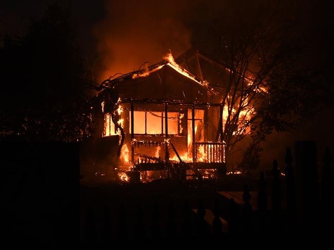 Flames engulf a home at Bilpin. Picture: Dan Himbrechts