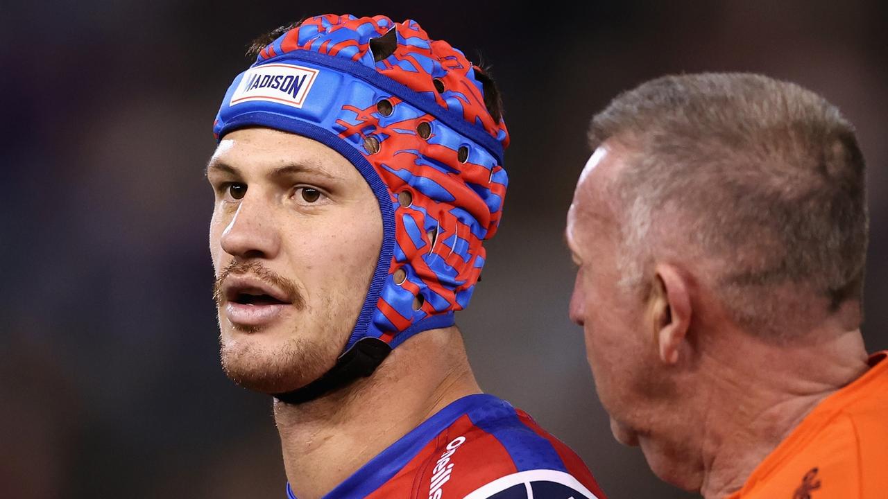 NEWCASTLE, AUSTRALIA - JULY 22: Kalyn Ponga of the Knights receives attention after being tackled high by Matthew Lodge of the Roosters during the round 19 NRL match between the Newcastle Knights and the Sydney Roosters at McDonald Jones Stadium, on July 22, 2022, in Newcastle, Australia. (Photo by Matt King/Getty Images)