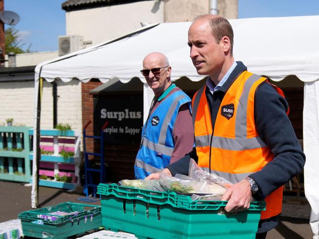 The royal helped load trays of food into vans during a visit to Surplus to Supper, a surplus food redistribution charity in Surrey. Picture: AFP