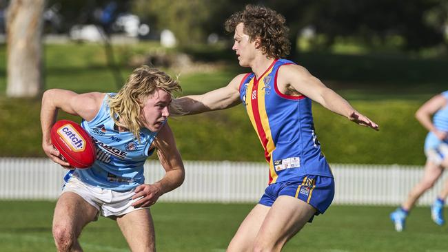 Jack Manson (right) tries to stop Hamish Dunkin from playing on when he played for Old Ignatians in 2021. He is now starring in the Sunraysia league. Picture: MATT LOXTON