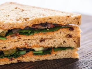 Healthy sandwich on wooden board