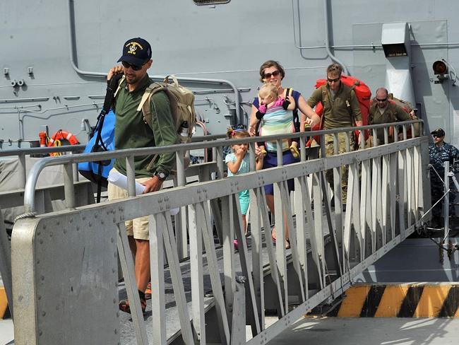 The Kaufmans disembarking from the USS Vandegrift. 