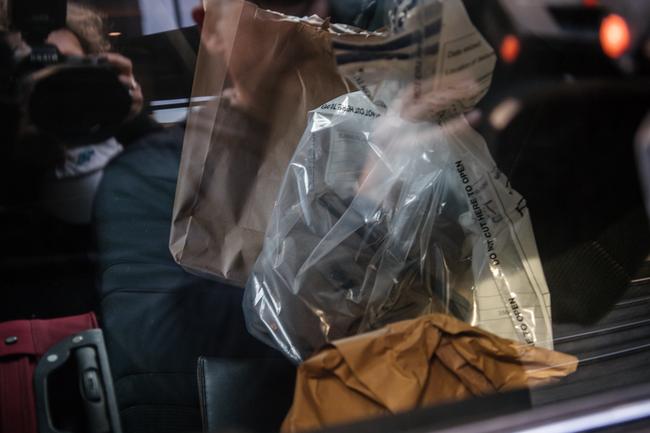 Bags of evidence are seen in a police car. Picture: AAP / Morgan Sett