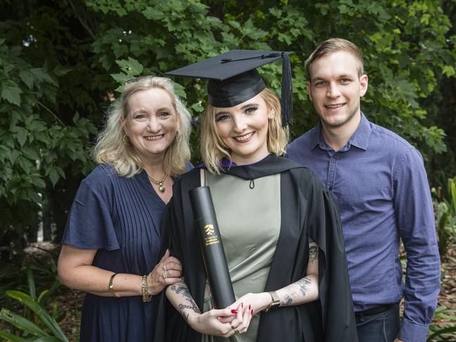 Bachelor of Laws graduate Laura Hawkins is congratulated by Debbie Hawkins and Jordan Hodges at a UniSQ graduation ceremony at Empire Theatres, Tuesday, February 13, 2024. Picture: Kevin Farmer