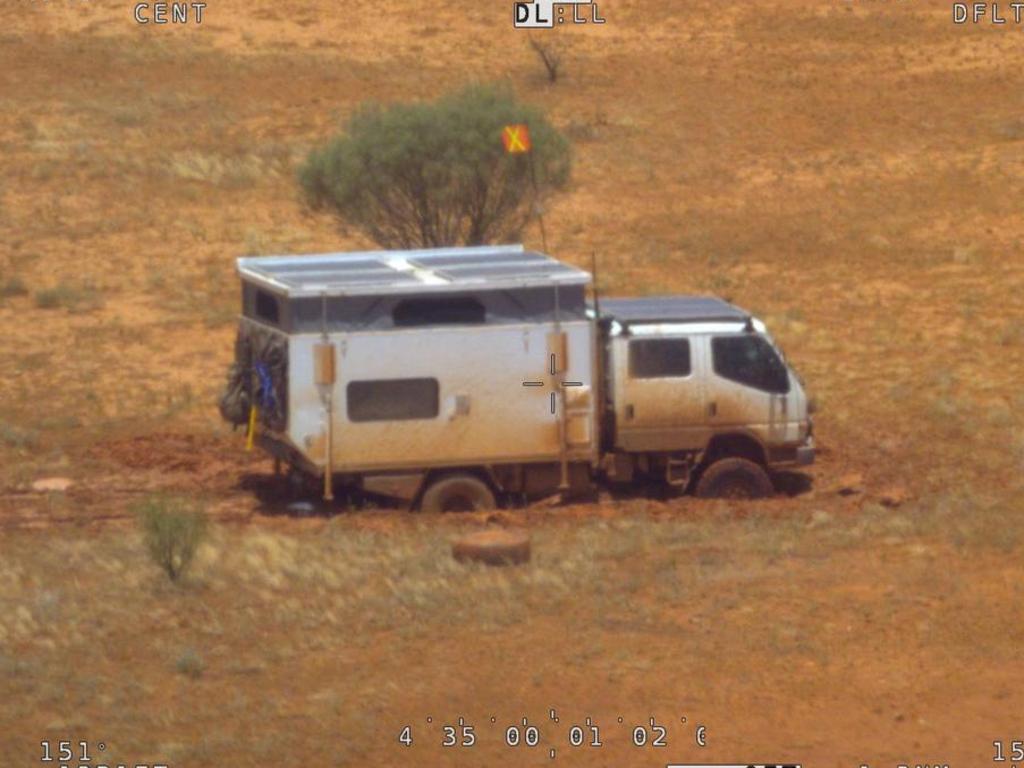 The stranded campervan following torrential rain in remote South Australia, about 150 kilometres northwest of Oodnadatta. Picture: Handout / Australian Maritime Safety Authority