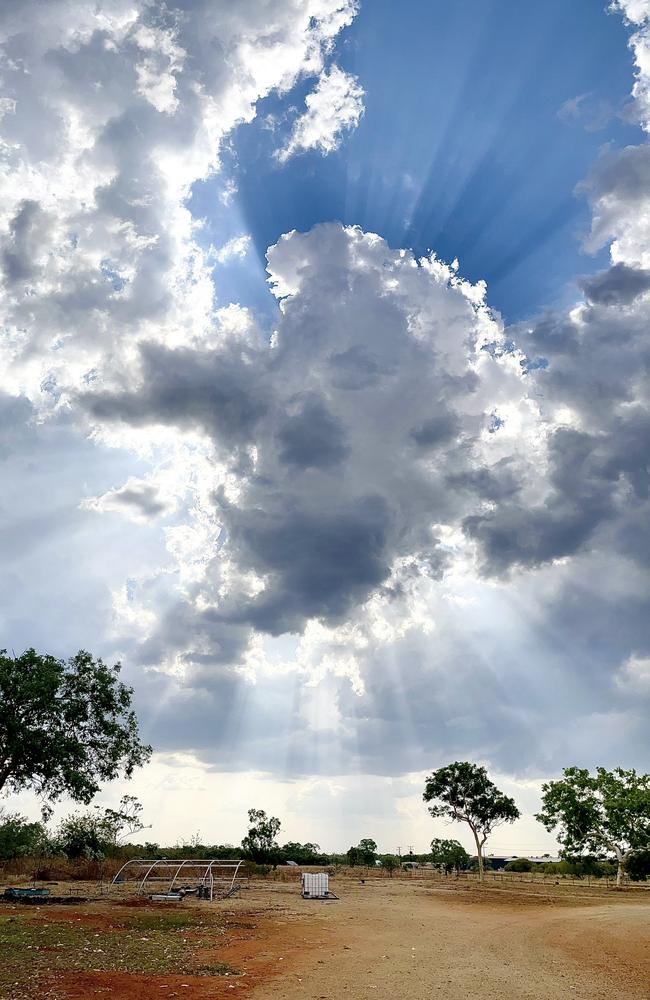 Sunlight pierces through the clouds over Lansdowne Road in Katherine. Picture: Emma Robertson