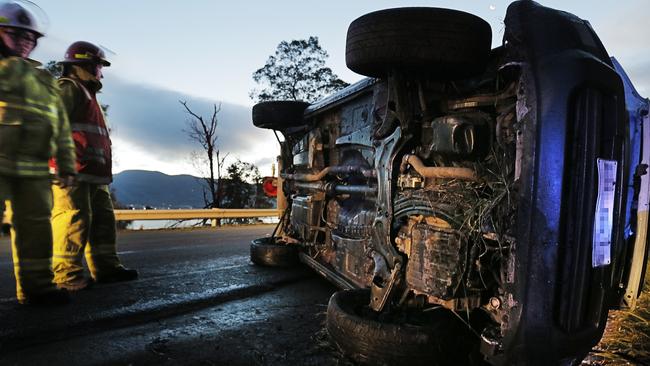 A car that rolled on East Derwent Highway near Old Beach. Picture: MATHEW FARRELL