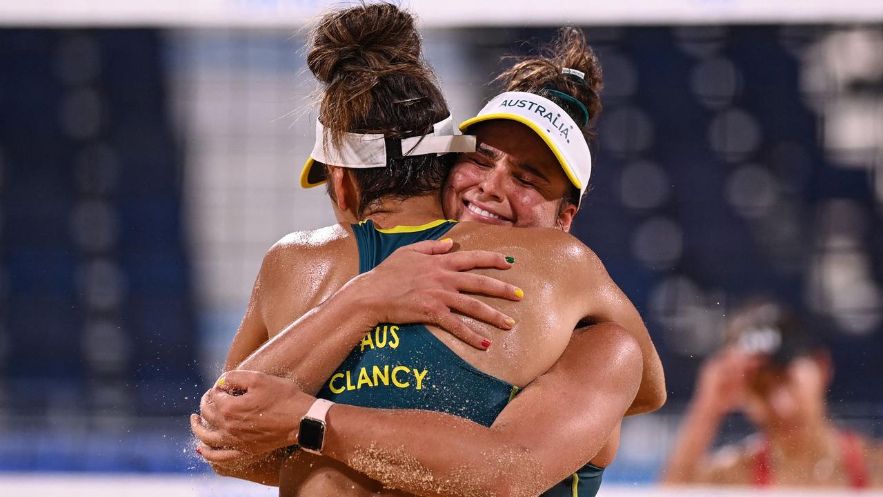 An embrace signifies a brilliant victory. Picture: AFP