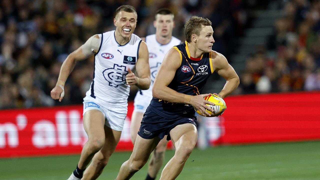 Adelaide's Jordan Dawson gets away from Carlton's Patrick Cripps during the AFL Gather Round match between the Adelaide Crows and Carlton Blues at the Adelaide Oval on April 13, 2023. Photo by Phil Hillyard