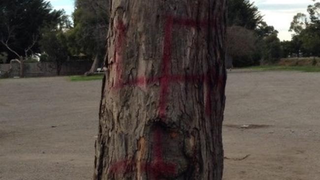 A Nazi swastika has been spray painted on a tree near Bittern station