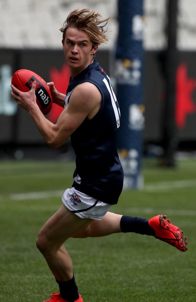 Dragon Louis Butler gathers the ball during the Under 18 championships match on Saturday.