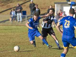 RIVALS: USQ's Ashley Freier (left) and Willowburn's Nathan Daly battle for possession. The two teams face-off in the Premier Men's grand final tomorrow at Clive Berghofer Stadium. Picture: Kevin Farmer