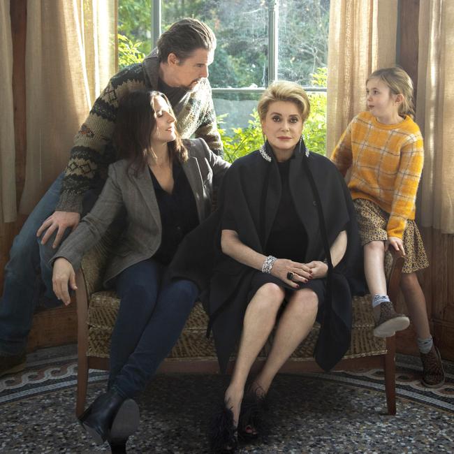 Ethan Hawke, Juliette Binoche, Catherine Deneuve and Clementine Grenier in a scene from The Truth.