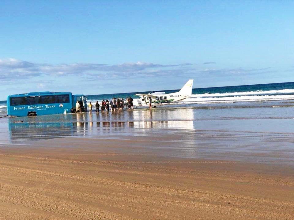 The Central Queensland Plane Spotting Blog has shared photos of a bus attempting to rescue the Air Fraser Island Airvan ahead of high tide. Picture: CQ Plane Spotting Blog