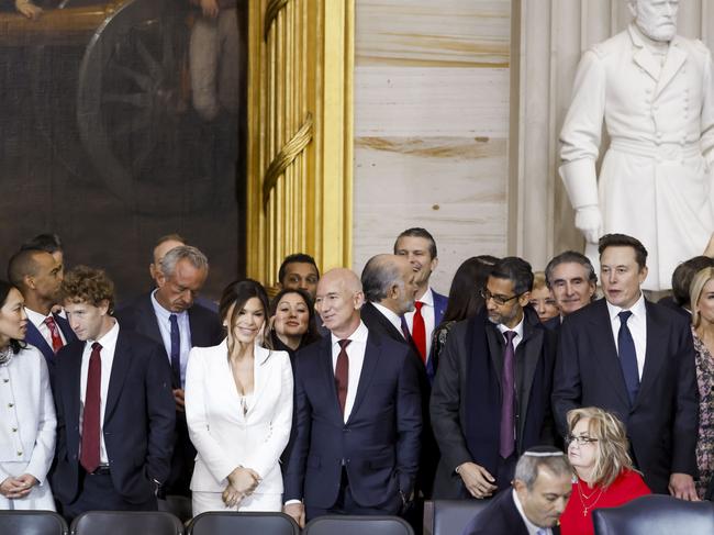 Four of the world’s richest men were snapped standing together at the ceremony. Picture: Getty