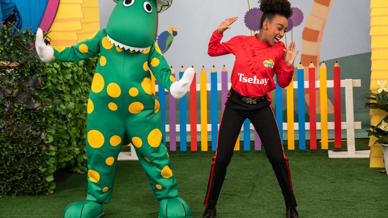 Red Wiggle Tsehay with Dorothy the dinosaur.