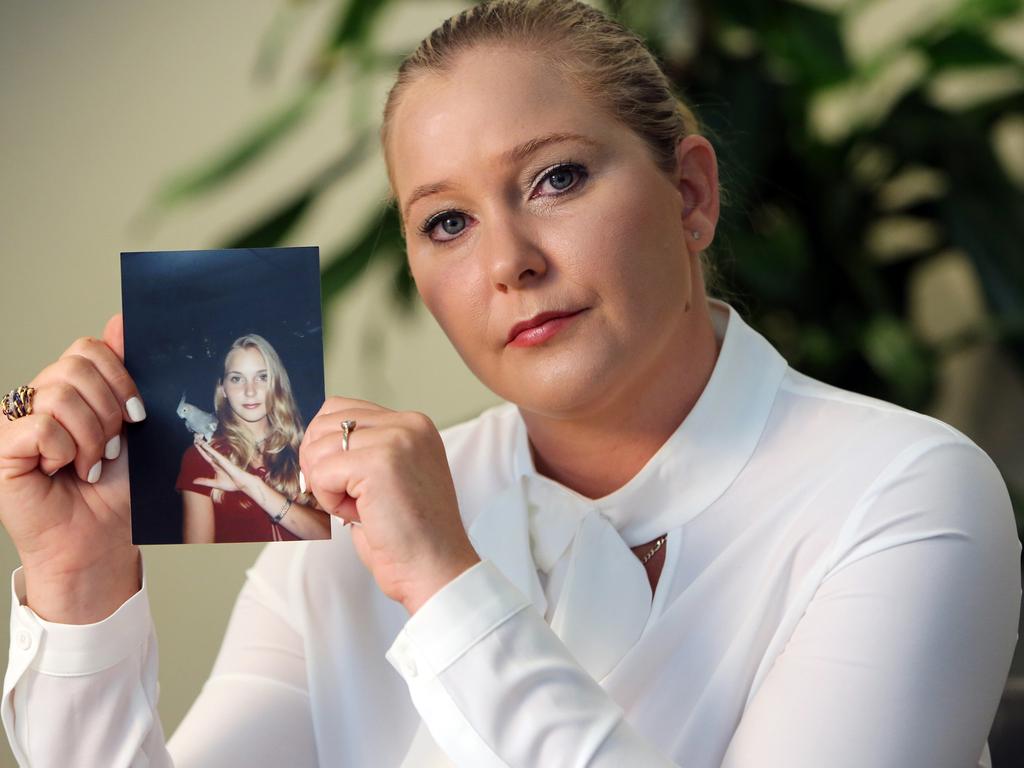 Virginia Giuffre holds a photo of herself at age 16, when she says Palm Beach multi-millionaire Jeffrey Epstein began abusing her sexually. Picture: Emily Michot/Miami Herald/Tribune News Service