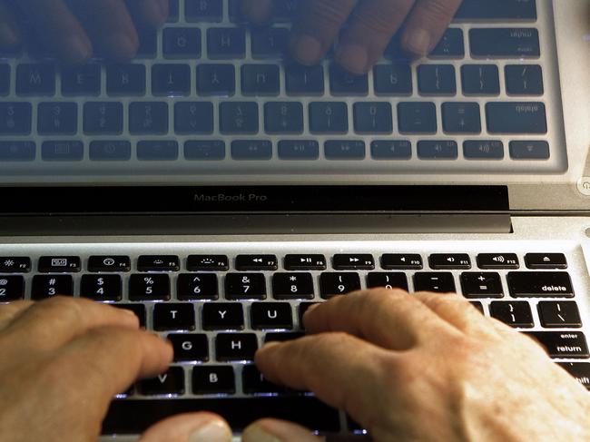 FILE - In this Wednesday, Feb. 27, 2013 photo illustration, hands type on a computer keyboard in Los Angeles. In the wake of the Heartbleed security threat, many security experts recommend a second layer of authentication _ typically in the form of a numeric code sent as a text message. You enter that code on the website to verify that it’s really you and not a hacker who doesn’t have your phone. (AP Photo/Damian Dovarganes, File)