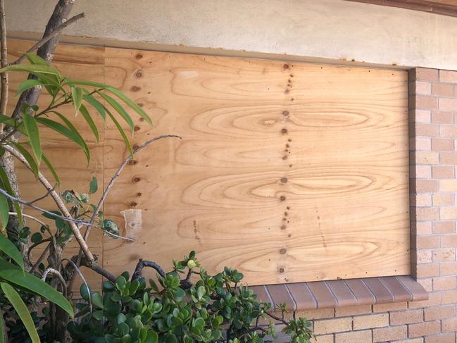 A boarded up window at the derelict Sea Life Aquarium at Manly.