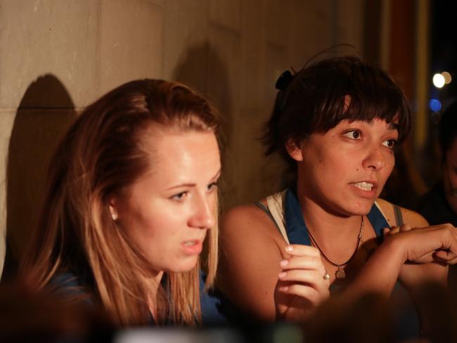 Women speak to the media after walking away from inside a police cordon following an incident in London. Picture: AP